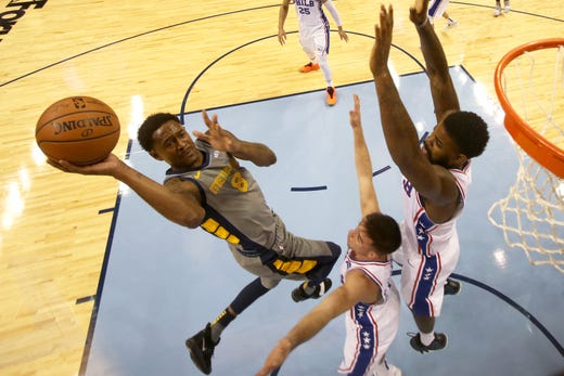 Memphis Grizzlies guard MarShon Brooks lays the ball up against Philadelphia 76ers guard T.J. McConnell, center, and Amir Johnson during their game at the FedExForum on Saturday, November 10, 2018.