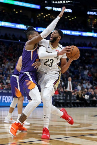 Nov 10, 2018; New Orleans, LA, USA; New Orleans Pelicans forward Anthony Davis (23) is foul by Phoenix Suns forward Richaun Holmes (21) in the first quarter at the Smoothie King Center. Mandatory Credit: Chuck Cook-USA TODAY Sports
