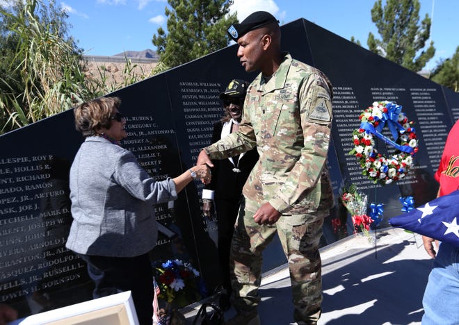LTC Anthony Gore, right, greets Marilyn ‘Dee’ Robinson during a ceremony in which the name of Robinson’s brother, Pfc. Edwin H. Sornson was added to the El Paso Vietnam Memorial.