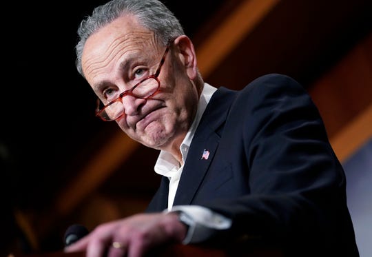 Senate Minority Leader Chuck Schumer of N.Y., pauses while speaking to members of the media at the Capitol in Washington, Nov. 7, 2018.