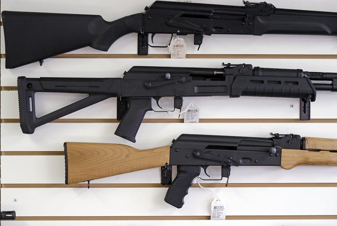 Washington gun shop owners expect sales to rise after voters approved Initiative 1639, which adds restrictions to the purchase of semi-automatic rifles.