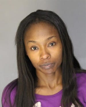 Jasmine Moore, 28, of Detroit has been arrested in charged in connection with the armed robbery and assault of a 75-year-old Dearborn psychiatrist on Oct. 10, 2018. Dearborn Police Chief Ron Haddad announced Moore's arrest at a press conference on Nov. 12, 2018.