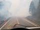 Smoke fills the road near the Cresta Powerhouse above Oroville Monday morning.