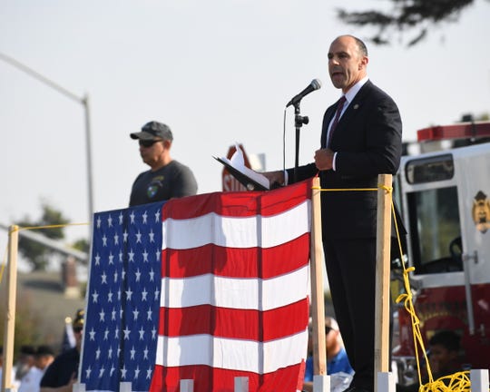 Rep. Jimmy Panetta, a Navy veteran, addresses Sunday's crowd at the eighth annual Monterey County Veterans Day Parade.