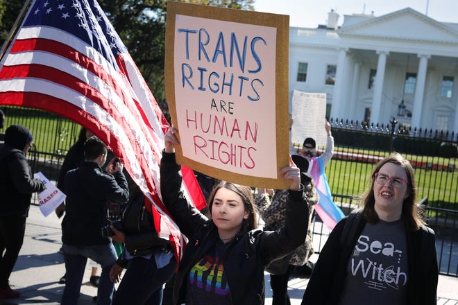 Activists from the National Center for Transgender Equality, partner organizations and their supporters hold a "We Will Not Be Erased" rally in front of the White House October 22, 2018.