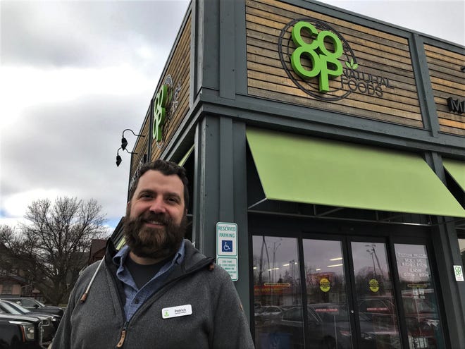 General Manager Patrick Sayler stands in front of The Co-Op Natural Foods in Sioux Falls. The Co-op is planning a large expansion.
