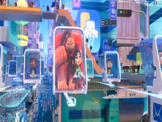 Ralph (voiced by John C. Reilly, center left) and Vanellope (Sarah Silverman) are wowed by the World Wide Web in "Ralph Breaks the Internet."