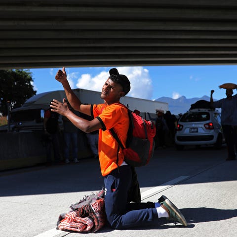 A Central American man traveling with a migrant...