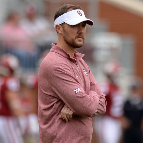 Oklahoma Sooners head coach Lincoln Riley watches...