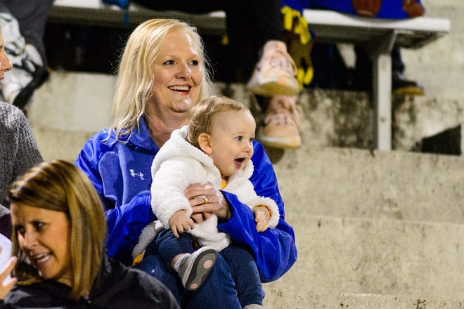 Lynn Tate, wife of Wren High School football coach Jeff Tate, enjoys the experience as she watches Wren's Class AAAA first-round playoff game against Greenville with their granddaughter, Sawyer.