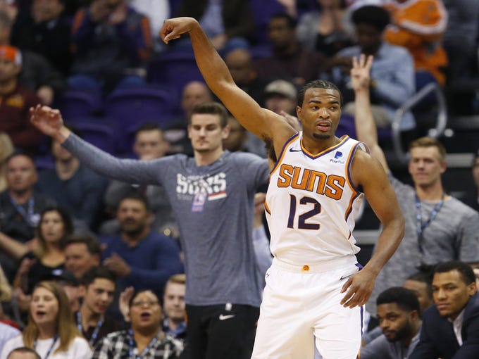 Phoenix Suns forward TJ Warren (12) celebrates a 3 point shot during a NBA game against the San Antonio Spurs at Talking Stick Arena in Phoenix on November 14.