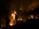 Firefighters hold a line in the Camp Fire with a control burn Near Bloomer Hill in Butte County in California on Nov. 14, 2018.  