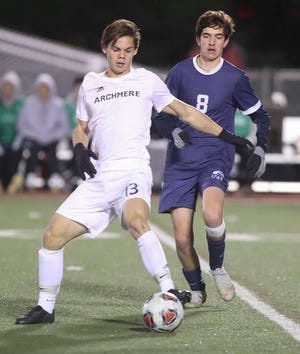 Archmere's Andrew Rosenbaum (left) tries to control in front of Wilmington Friends' Ryan Evans in the second half of the Quakers' 2-1 win in a semifinal of the DIAA Division II state tournament.