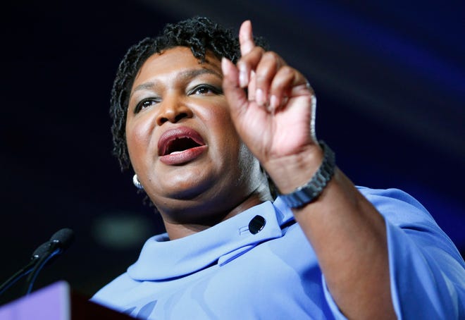 Democratic gubernatorial candidate Stacey Abrams is pictured speaking to supporters at her election night headquarters at the Hyatt Regency in Atlanta.