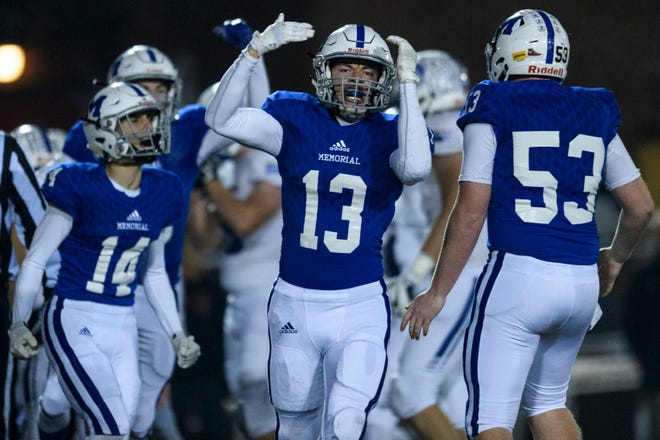 Memorial's Evan Janiga (13) reacts to a Tiger interception over the Bishop Chatard Trojans in the second quarter of the IHSAA Class 3A semistate championship at Enlow Field  in Evansville, Ind., Friday, Nov. 16, 2018.