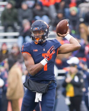 Nov 17, 2018; Champaign, IL, USA; Illinois Fighting Illini quarterback AJ Bush Jr. (1) sets up to pass during the first quarter against the Iowa Hawkeyes at Memorial Stadium.