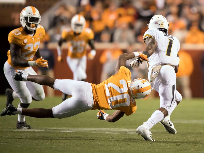Missouri running back Tyler Badie (1) gets past Tennessee defensive back Bryce Thompson (20) during the Tennessee and Missouri football game on Saturday, November 17, 2018.