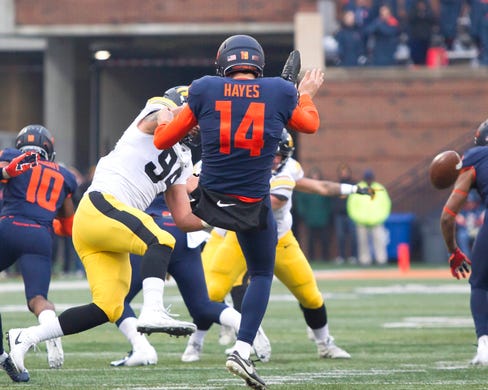 Nov 17, 2018; Champaign, IL, USA; Iowa Hawkeyes defensive end A.J. Epenesa (94) blocks the punt from Illinois Fighting Illini punter Blake Hayes (14) during the second quarter at Memorial Stadium.