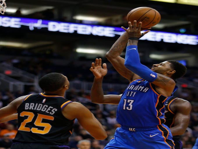 Oklahoma City Thunder forward Paul George (13) in the second half during an NBA basketball game against the Phoenix Suns, Saturday, Nov. 17, 2018, in Phoenix. (AP Photo/Rick Scuteri)