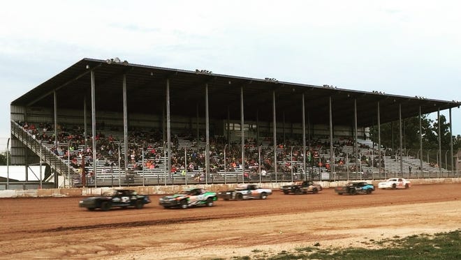 Race cars in the Street Stock class zoom past the grandstand at Luxemburg Speedway. Ashley Stevens and Skyhigh Entertainment, LLC, were named promoters for the 2019  racing season at the third-mile track at the Kewaunee County Fairgrounds.