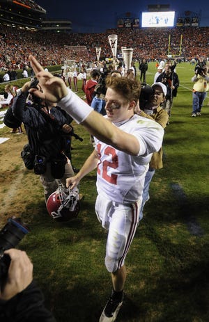 Alabama quarterback Greg McElroy (12) walks off the field following Alabama's victory over Auburn at the Iron Bowl in Auburn, Ala. on Friday November 27, 2009.(Montgomery Advertiser, Mickey Welsh)