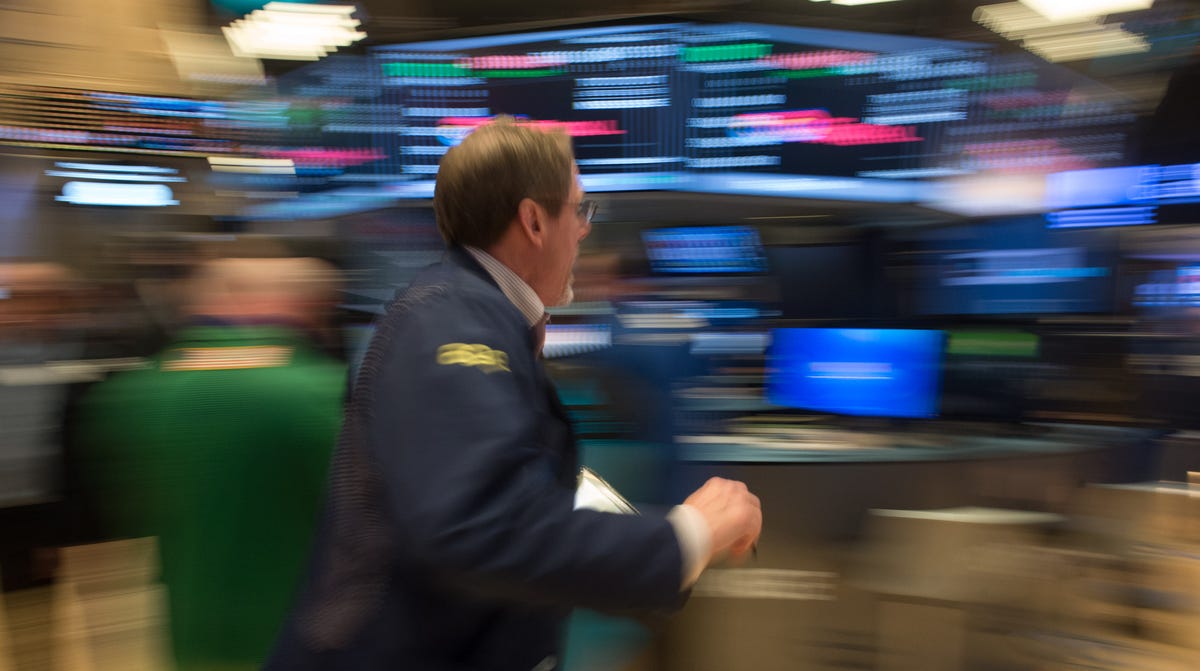 A trader runs across the floor after the Dow Jones closing bell at the New York Stock Exchange, February 21, 2017 in New York.   US stocks jumped with retailers and energy firms among the winners as positive sentiment about President Donald Trump's economic agenda again lifted the market to fresh records at the close. / AFP PHOTO / 30202530A / Bryan R. SmithBRYAN R. SMITH/AFP/Getty Images ORG XMIT: NYSE clos ORIG FILE ID: AFP_LX0FJ