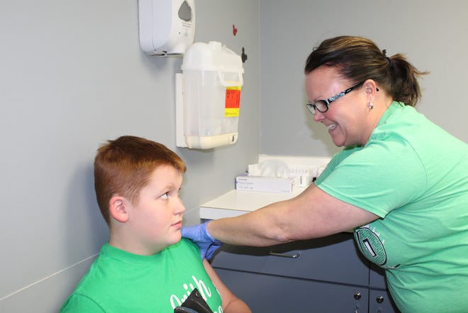 Jimmy Maire, of Gibsonburg, gets a flu shot at the Sandusky County Health Department.