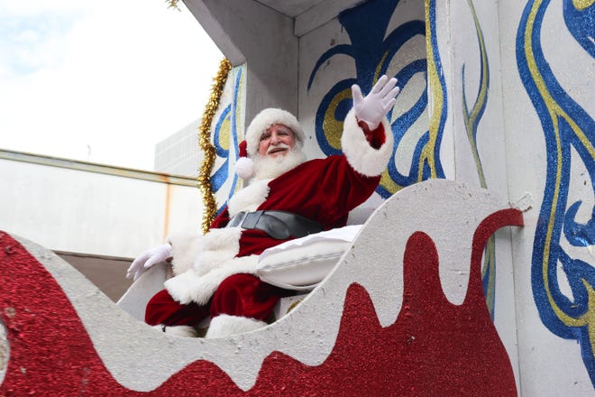 Santa Clause delighted the children during his ride in this years parade thru Lafayette.