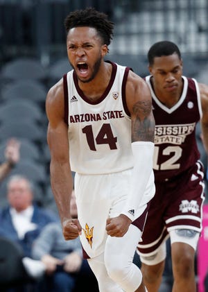 Arizona State's Kimani Lawrence (14) celebrates after scoring against Mississippi State during the second half of an NCAA college basketball game, Monday, Nov. 19, 2018, in Las Vegas. Arizona State won 72-67.
