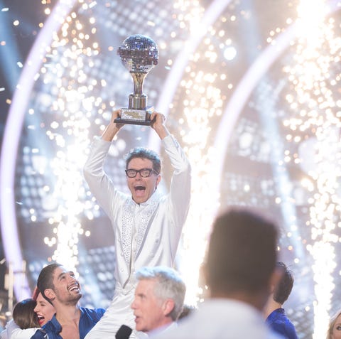 Bobby Bones hoists the mirrorball trophy on...