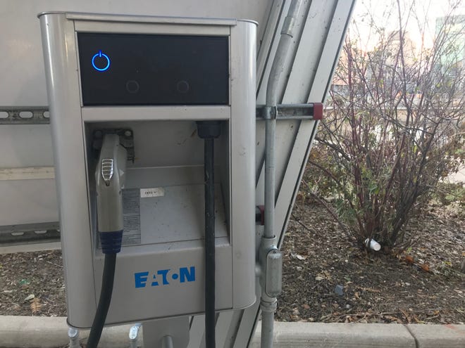 An electric car charging station in Lansing.  The city of East Lansing is considering a proposal that would require developers to include charging stations in their site plans.