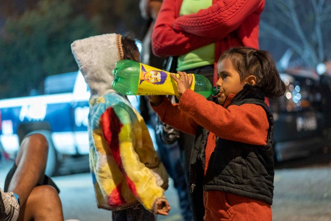 Several charter buses arrive just past midnight Nov. 20, 2018, and in the early hours Nov. 21 to the Unidad Deportiva Benito Juarez, the sports complex that city opened up as a makeshift shelter in Tijuana, Mexico. It's unclear exactly how many migrants had traveled on board. But inside, 3,000 other migrants had been arriving in Tijuana since last week. Overcrowded shelter, with minimal options on space with little other choices, many of them settled into the cold and damp field of the outdoor baseball stadium.