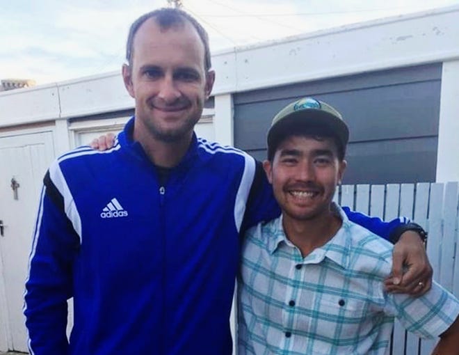 In this October 2018 photo, American adventurer John Allen Chau, right, stands for a photograph with Founder of Ubuntu Football Academy Casey Prince, 39, in Cape Town, South Africa, days before he left for in a remote Indian island of North Sentinel Island, where he was killed.