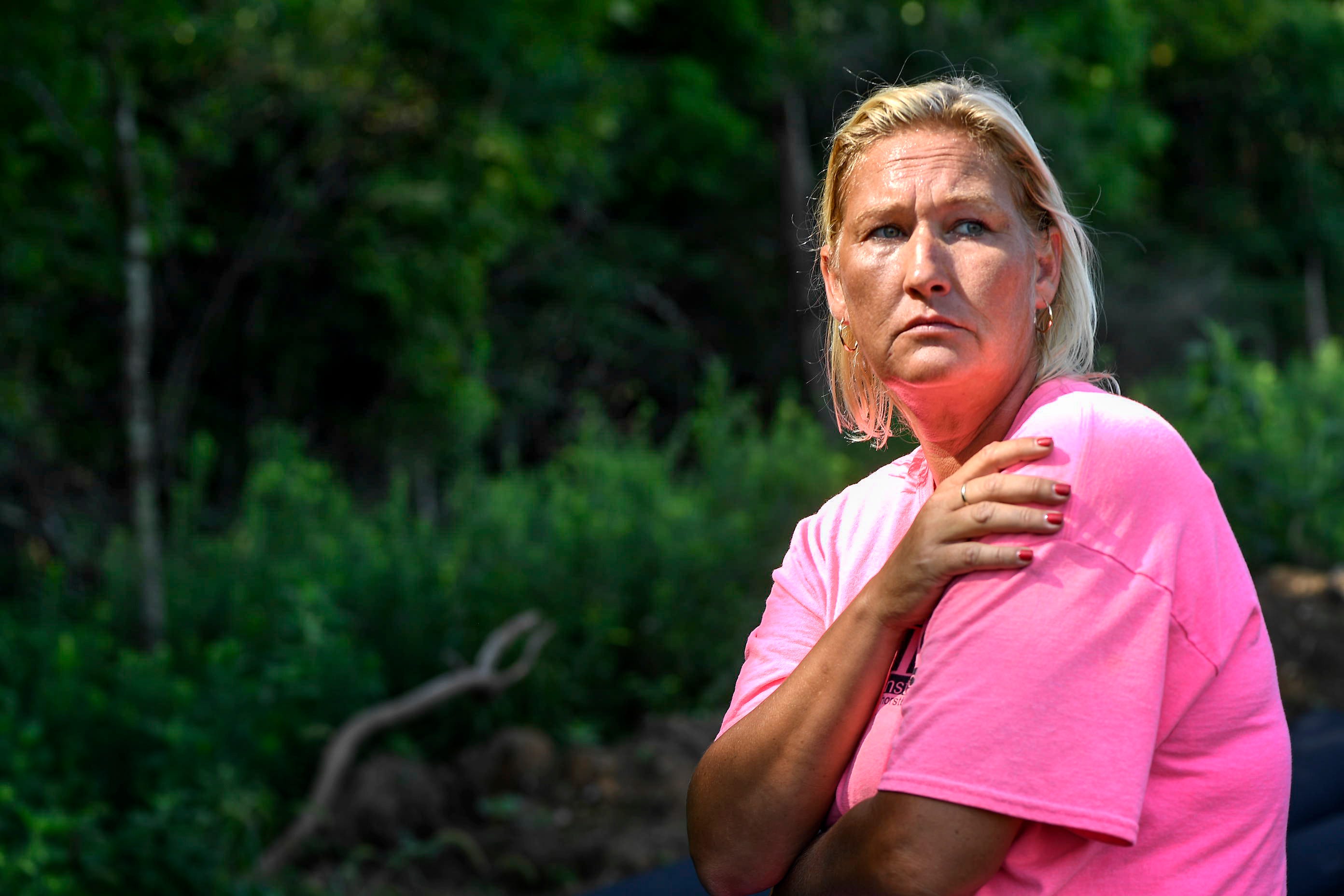 Lydia French poses for a portrait along the woods where she and Travis Reinking saw each other during the manhunt for the Waffle House suspect.