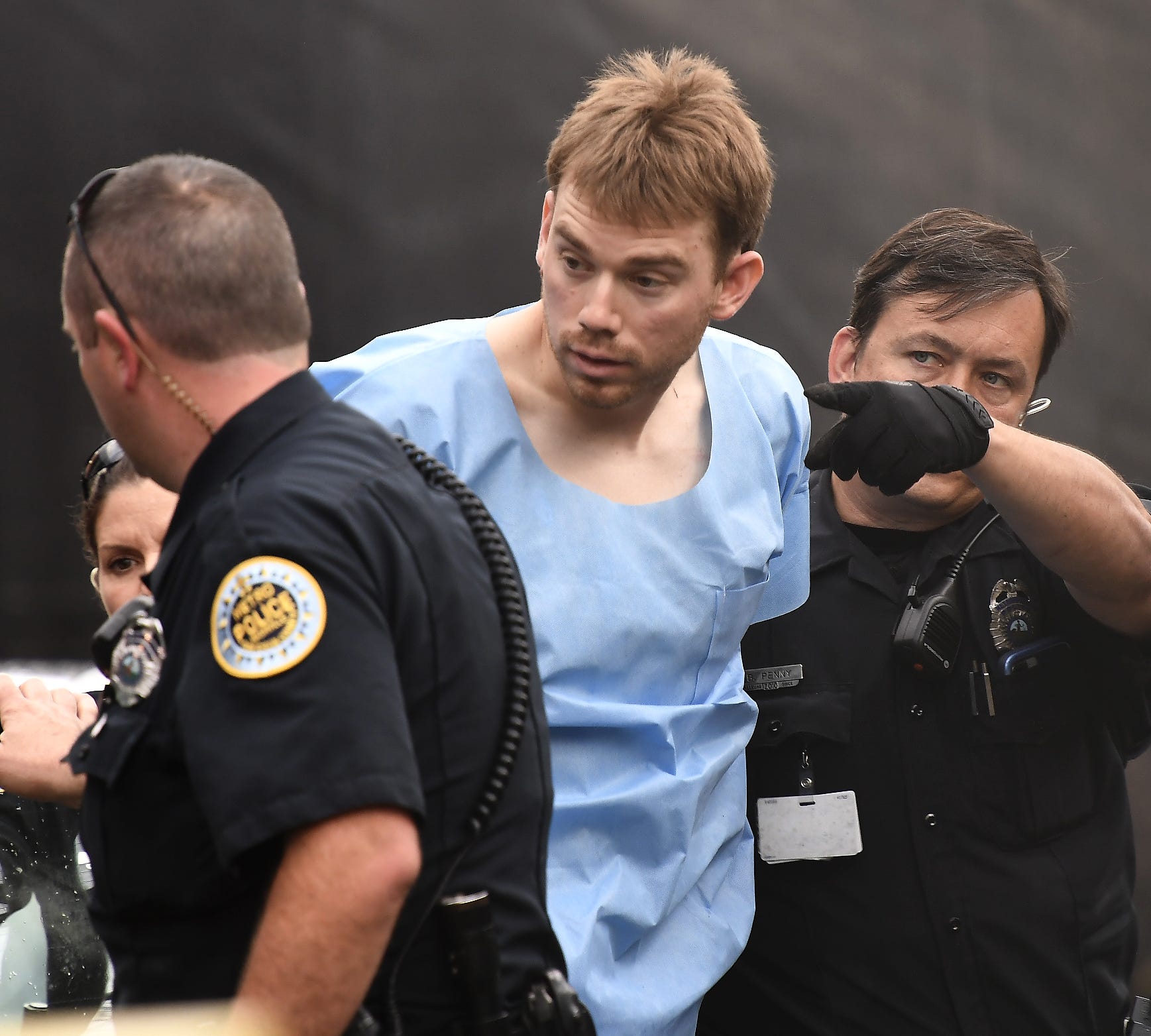 Law enforcement personnel escort Waffle House shooting suspect Travis Reinking into booking Monday, April 23, 2018, at Hill Detention Center in Nashville.