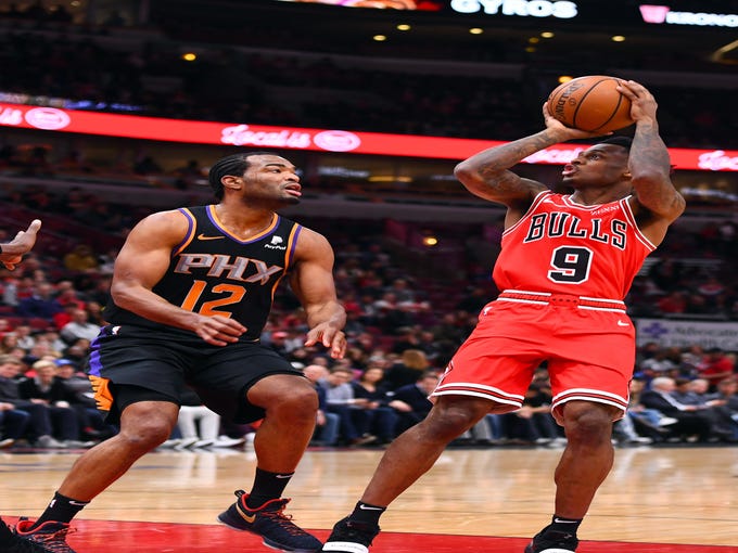 Bulls guard Antonio Blakeney (9) shoots the ball against Suns forward TJ Warren (12) during the first half of a game Wednesday at the United Center.