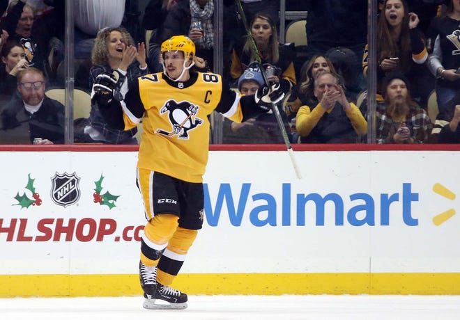Pittsburgh Penguins center Sidney Crosby reacts after scoring a goal against the Dallas Stars.