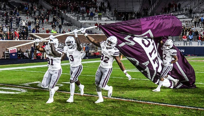 Mississippi State players celebrate following a win over Mississippi in Oxford, Miss., Thursday, Nov. 22, 2018.