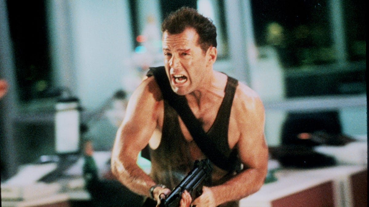 John McClane (Bruce Willis) is forced to fend off terrorists who take a corporate holiday party hostage in "Die Hard."