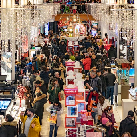 People shop at the Herald Square Macy's  for the...