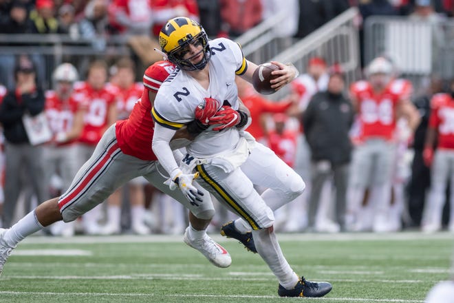 Michigan quarterback Shea Patterson was sacked three times in Saturday's loss at Ohio State.