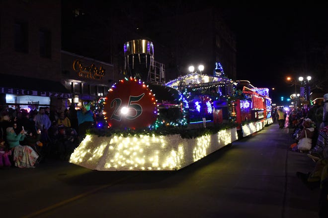 People gather to watch the annual Parade of Lights in downtown Sioux Falls, S.D., Friday, Nov. 23, 2018.