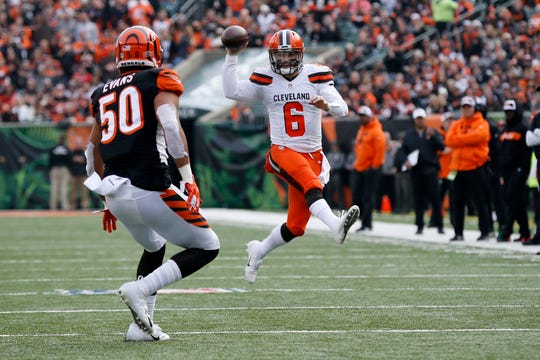 Cleveland Browns quarterback Baker Mayfield (6) pump fakes as he scrambles for a gain in the second quarter of the NFL Week 12 game between the Cincinnati Bengals and the Cleveland Browns at Paul Brown Stadium in downtown Cincinnati on Sunday, Nov. 25, 2018.