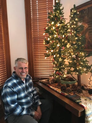 Jim Price sits in a corner of his house at 301 Overton St. It will be on the East Row Victorian Christmas tour, Nov. 25, 2018.