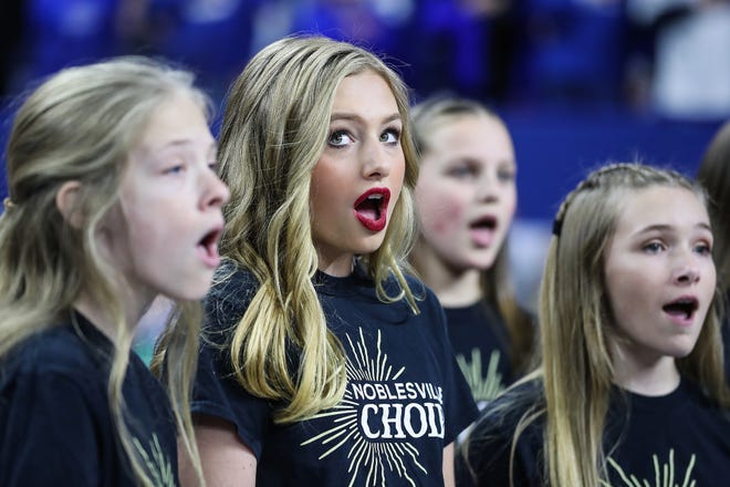 Ella Whistler and fellow members of the Noblesville West Middle School choir perform the national anthem before the Indianapolis Colts' game against the Miami Dolphins at Lucas Oil Stadium in Indianapolis, Sunday, Nov. 25, 2018. 