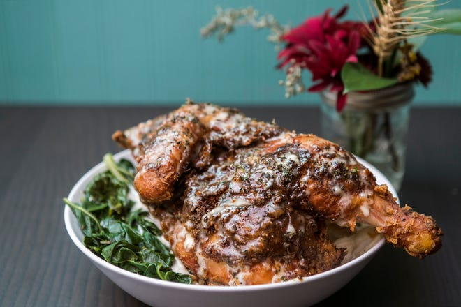 A half chicken entree featuring butter milk fried chicken, smokey collard greens, house made macaroni & cheese and coleslaw dressing from The Farmacy NJ in Palmyra..