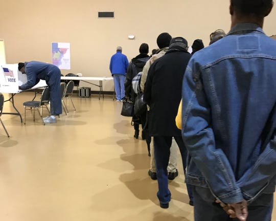 Voters stand in line to vote during a recent election in Hinds County.