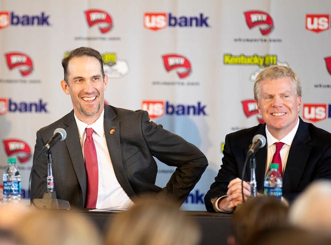 WKU's new head coach Tyson Helton shares a smile with WKU athletic director Todd Stewart during coach Helton's press conference as the new head coach of the Hilltoppers at the Harbaugh Club in Houchens-Smith Stadium Nov. 27 in Bowling Green. "It's not about making championships," said Helton. "Its about making champions." Helton comes to WKU after working for Tennessee and Southern California.