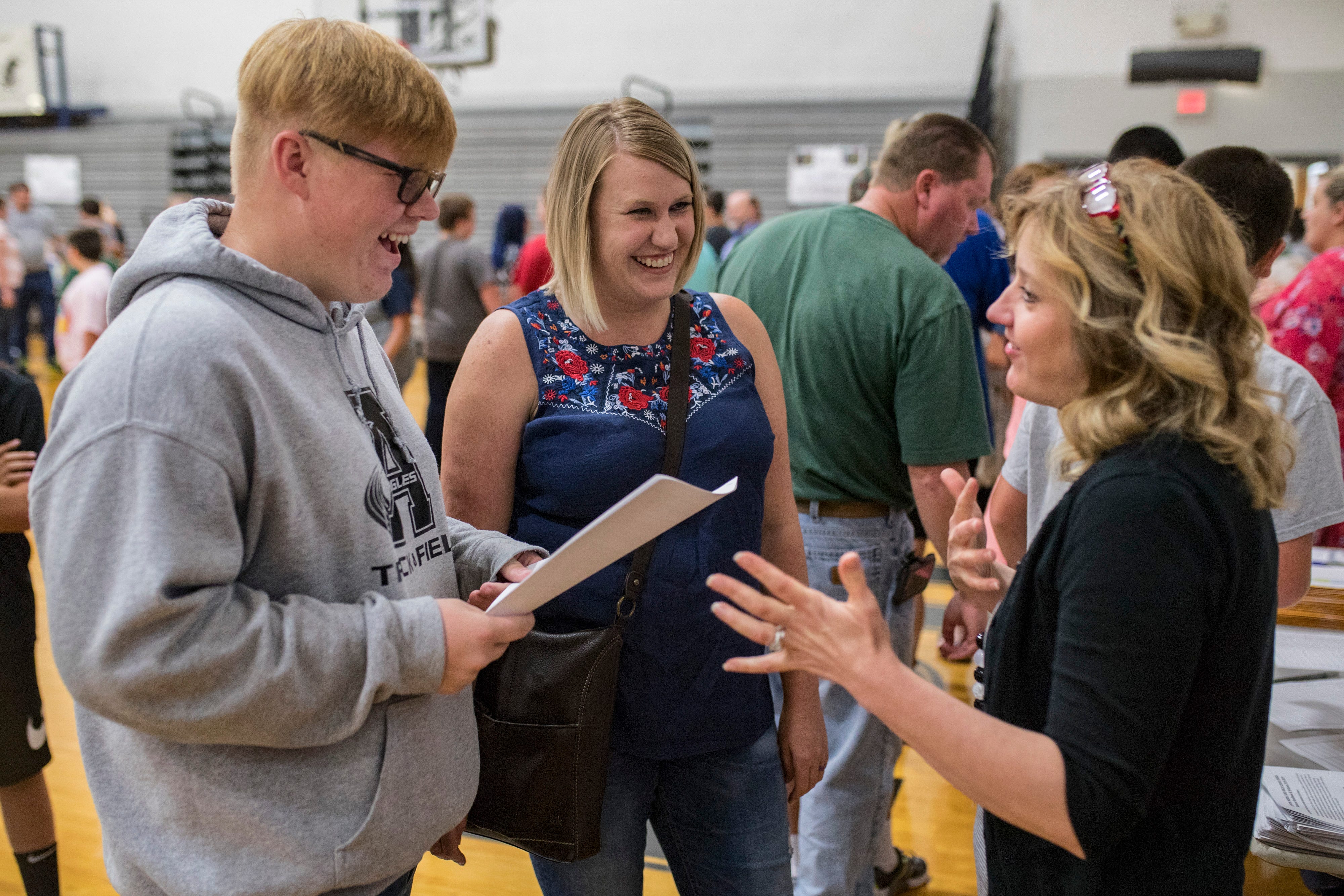 Austin High School freshman and show choir student, Bentley Mahaney, from left, and mother Christy Turner talk with choir instructor Kathy Risk-Sego during an open house at the start of school. “She’s almost like a second mom,” Mahaney said of Risk-Sego. “I’ve been with her since seventh grade and she’s always been someone I could talk to.” Aug. 8, 2018