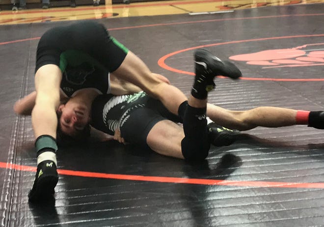 Clear Fork's Mike Morganstern sees things from upside down during his 2-2 draw with Madison's Adam Cook in Monday's all-star wrestling preview.